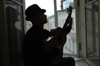 Omar plays by a window